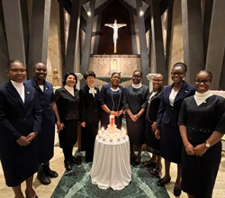 The nine new sisters of SSND stand together as part of their celebration of profession of first vows in Rome, Italy in December 2024