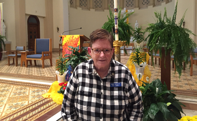 Associate Pat DeBill stands in church as part of her 40th anniversary as an SSND associate. 