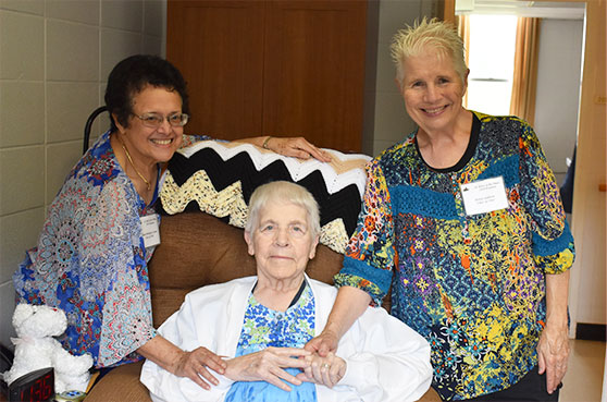 Liliana Lizano, SMP alum, S. Theresa Dietz and Helen Addison pose for a photo at St. Mary of the Pines in Chatawa, Mississippi. 