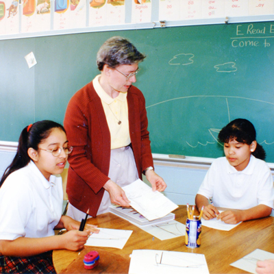 Sister Mary Beck with 5th grade students in the late 1990s to the early 2000s.