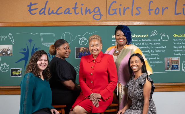 Marian Middle School administrators and staff pose in one of the school's classrooms